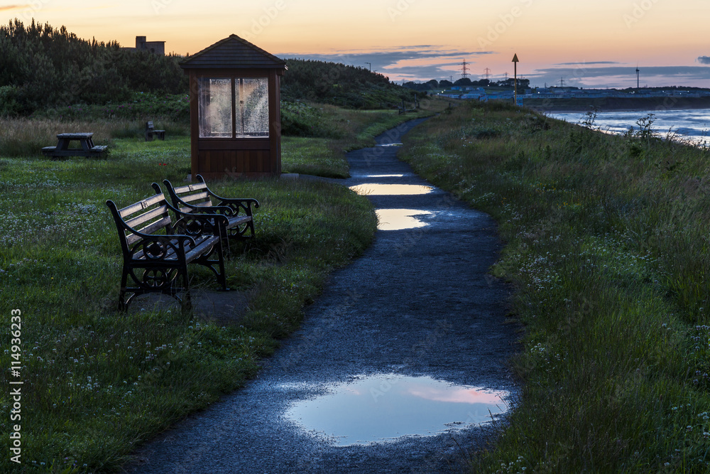 Seaside Wooden Shelter and bench seats at Cambois Beach on the coast of Northumberland, England, UK. Images taken at sunset. Seaside Wooden Shelter and bench seats at Cambois Beach on the coast of Northumberland, England, UK. Images taken at sunset.