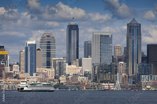 Seattle Skyline. A summertime view of the Seattle skyline looking from west Seattle across Elliott Bay. Cruise ships, ferryboats, tugboats, and freighters are a common sight in this maritime city. © LoweStock