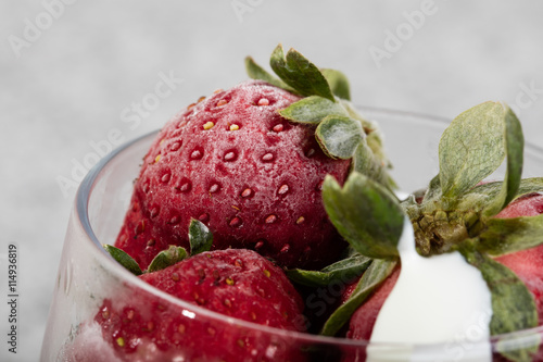 Frozen strawberry with sour cream in glass photo