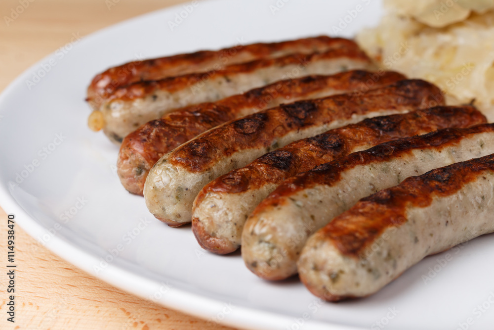Authentic sausages from Nuremberg Bavaria with Sauerkraut and Roll