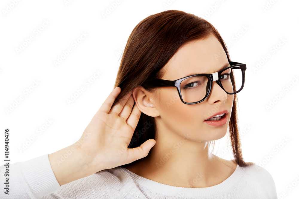 Shocked young woman overhearing a conversation Shocked young woman overhearing a conversation