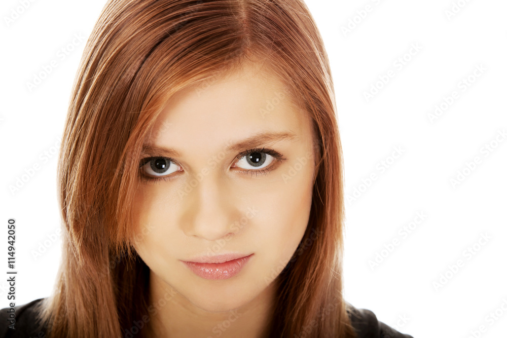 Pretty teenager girl smiling in cheerful mood Pretty teenager girl smiling in cheerful mood