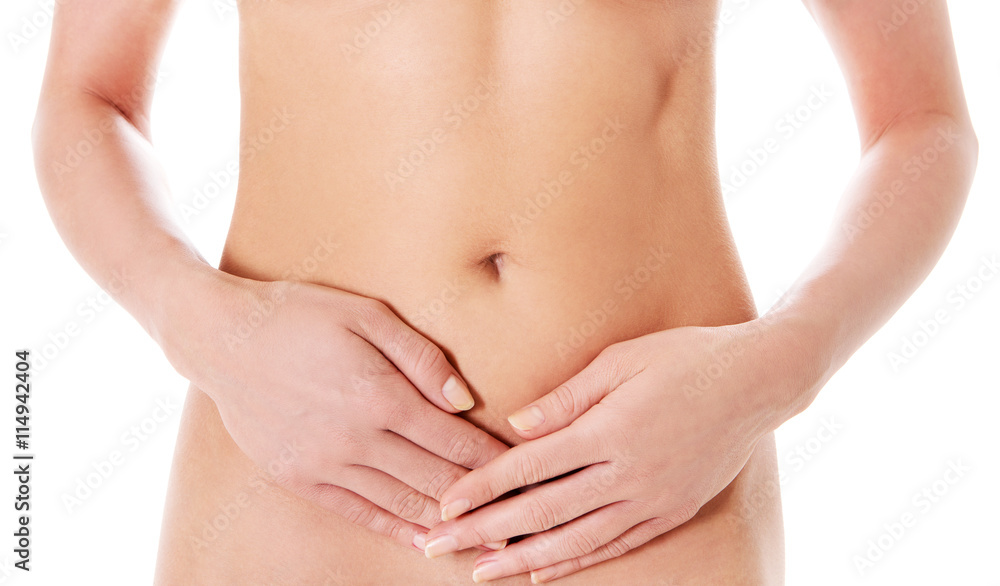 Body care, pregnancy diet concept, woman holding hands on the stomach. Body care, pregnancy diet concept, woman holding hands on the stomach.
