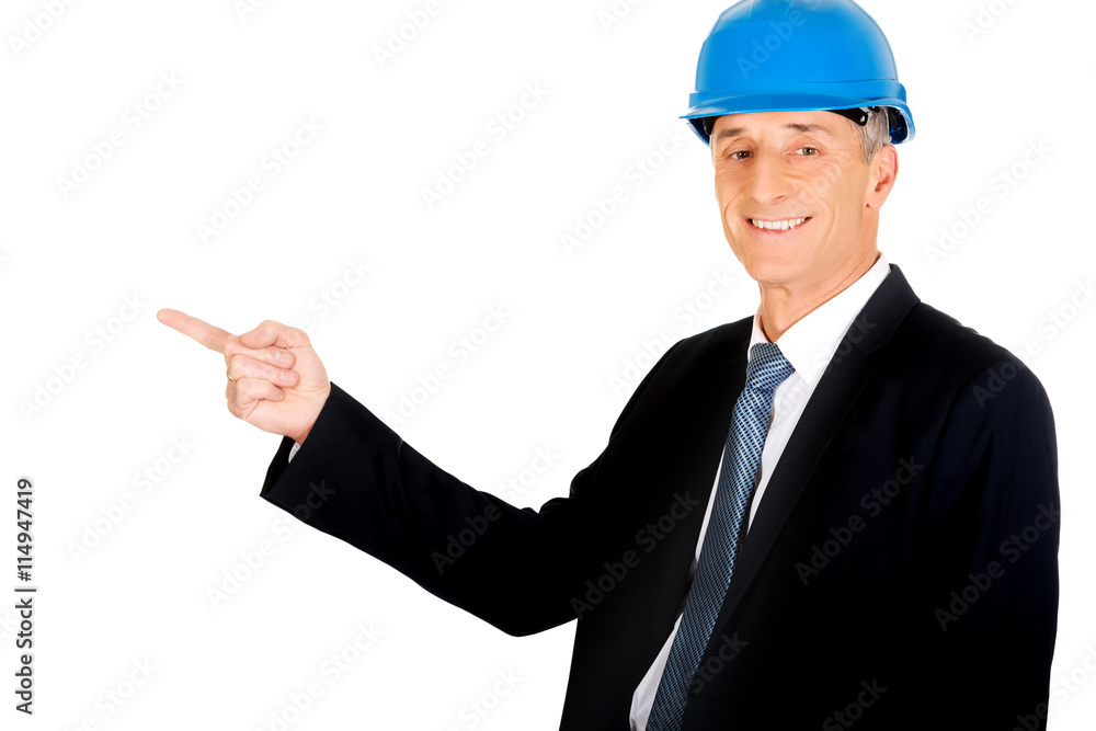 Businessman engineer pointing to the left Businessman engineer pointing to the left