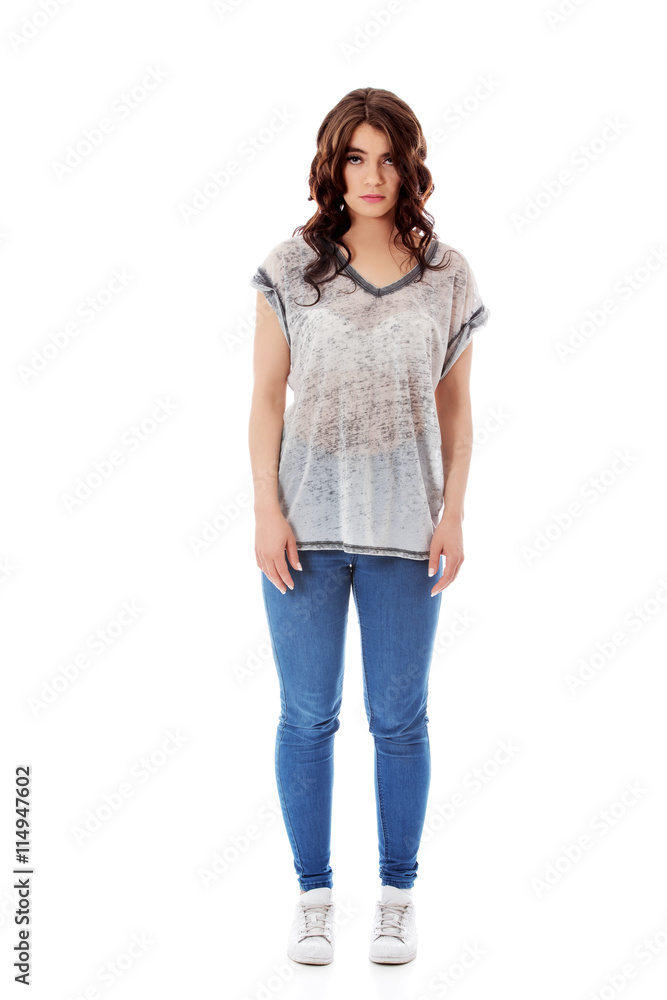 Fototapeta premium Young unhappy woman with long dark hair.