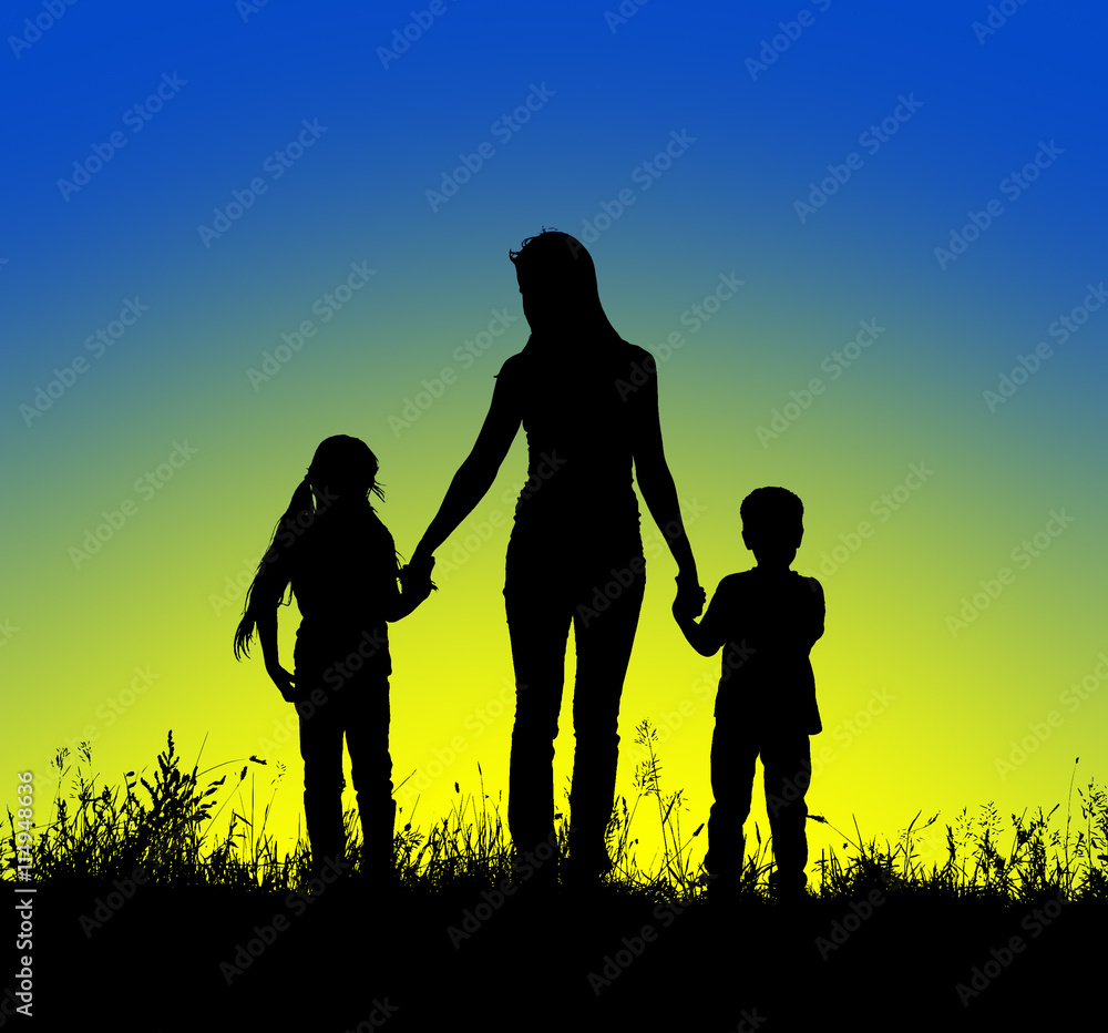silhouette mother and child holding hands at sunset