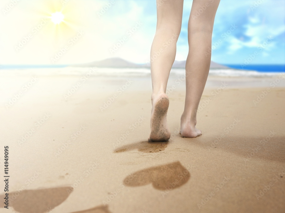 woman walking on seaside and leaving footprints woman walking on seaside and leaving footprints