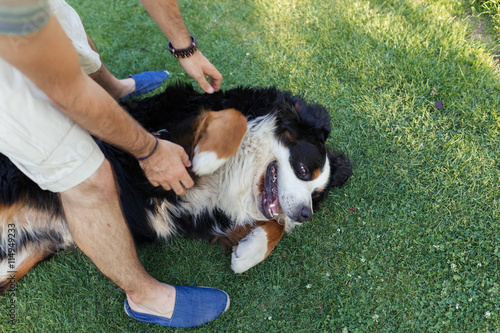 Man hugging a big black dog