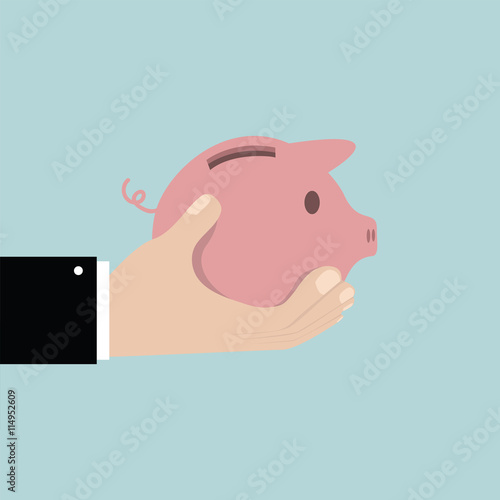 Saving the money in piggy bank. Saving money concept.