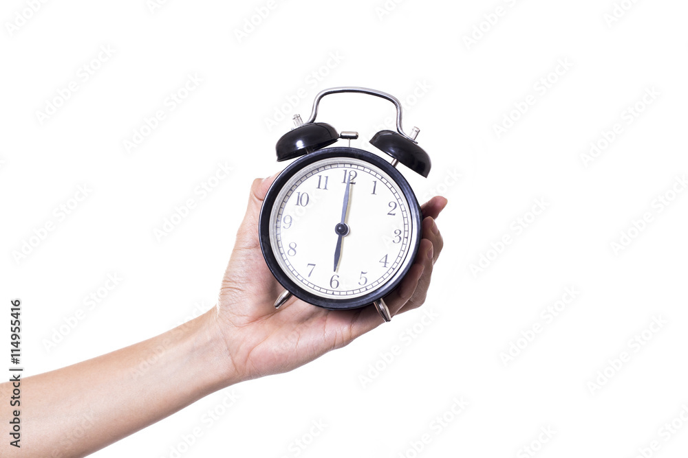 hand holding alarm clock isolated on white background hand holding alarm clock isolated on white background