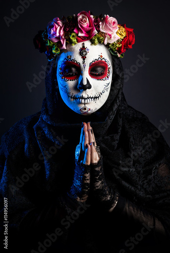 Sugar skull girl with flowers