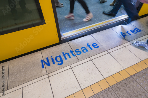 Photography Nightsafe area sign on railway platform