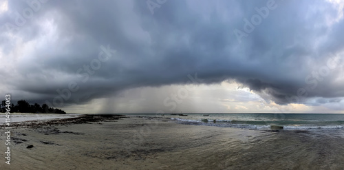 Beautiful tropical beach under gloomy sky