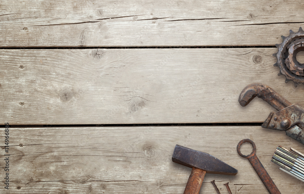 Old tools on wooden table with free space for text. Traditional handmade tools for craftsmen.