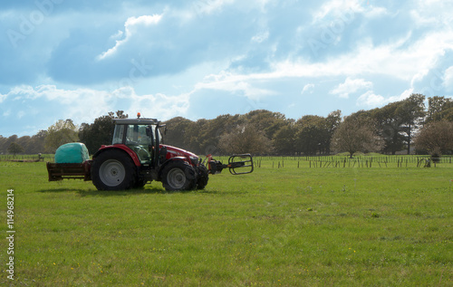 Red tractor on a field