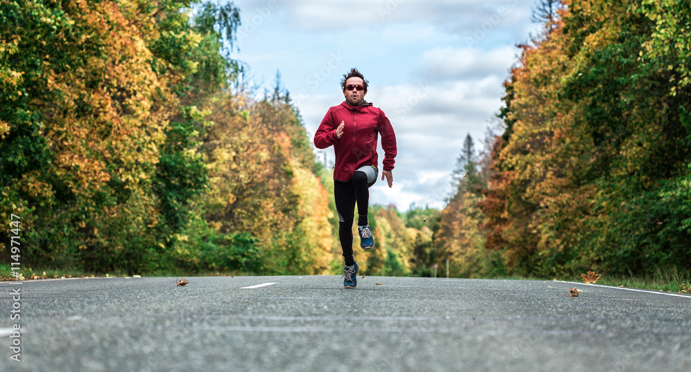 Fototapeta premium Man runs on the road