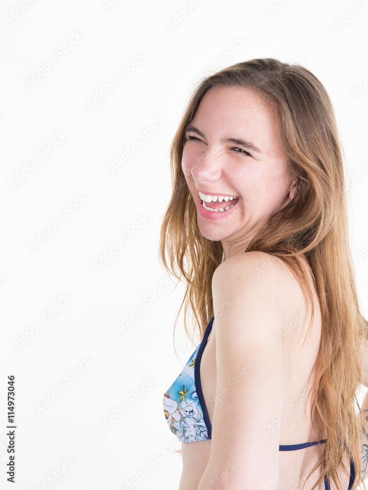 Laughing young blond woman in a bikini isolated on white Laughing young blond woman in a bikini isolated on white