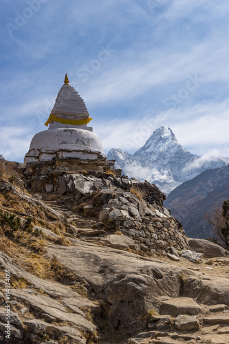 White stupa with Ama Dablam mountain peak
