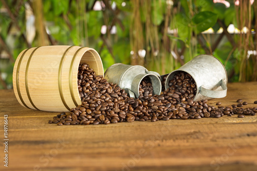 Roasted coffee beans on a wood floor