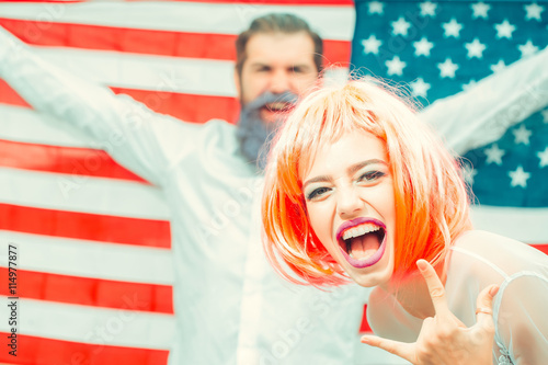 фотографія Happy young patriotic Americans bright make up and hair celebrating Independence
