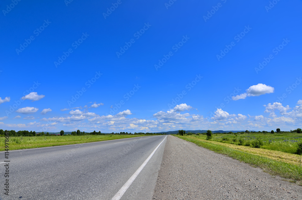 Straight empty road running to horizon Straight empty road running to horizon