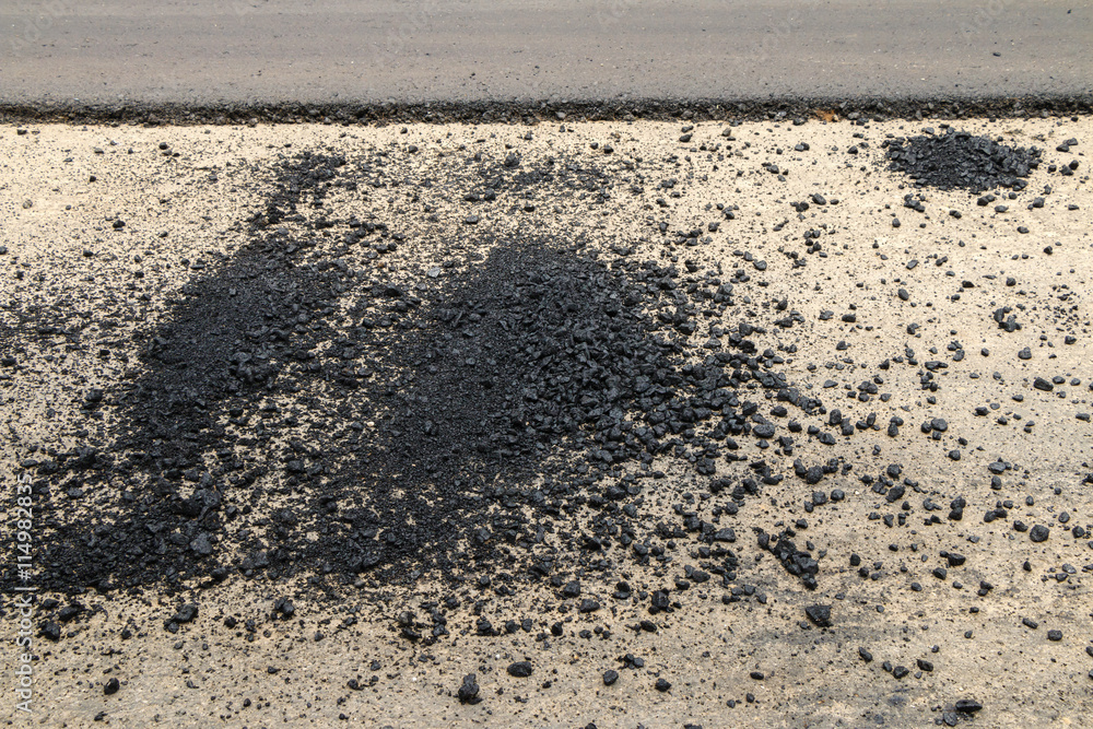 Close-up asphalt at the road under construction. Close-up asphalt at the road under construction.