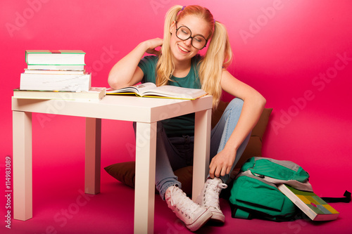 Dreamy schoolgirl with hairstyle as Pippi Longstocking and big e photo