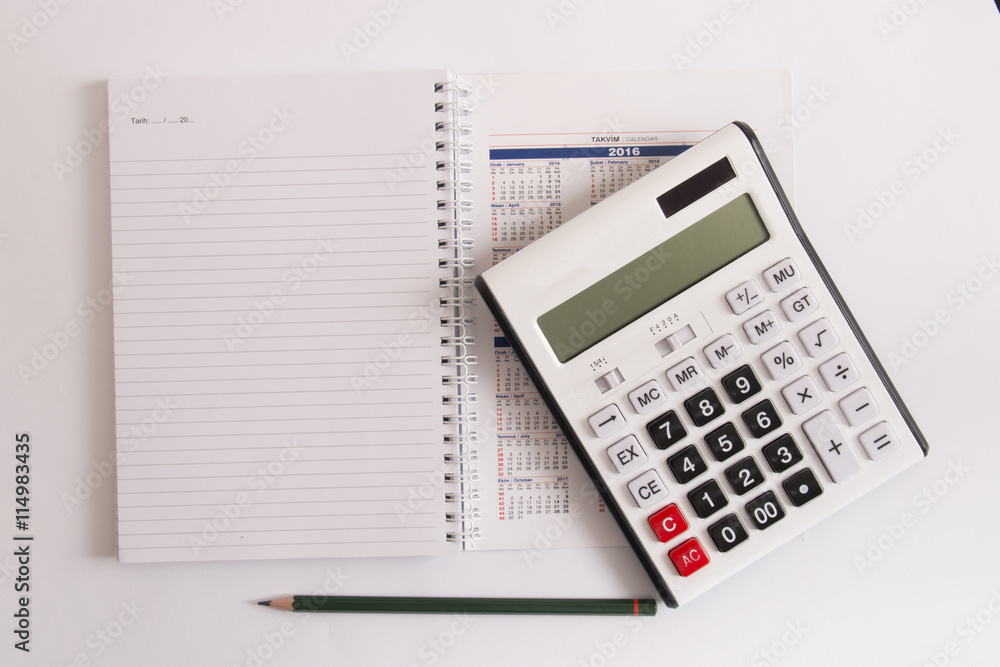 isolated calculator on calendar and empty page isolated calculator on calendar and empty page
