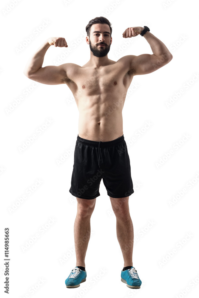 Front view of young bearded fit athlete flexing muscles. Full body length portrait isolated over white studio background. Front view of young bearded fit athlete flexing muscles. Full body length portrait isolated over white studio background.