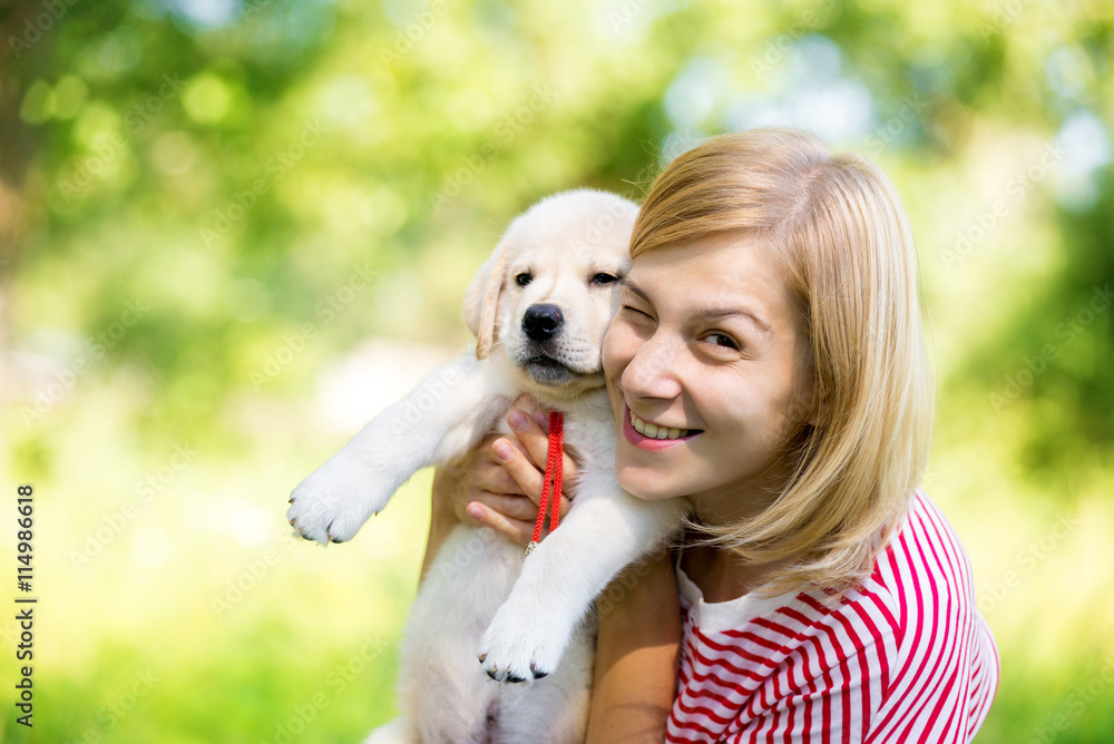 Girl with labrador puppy Girl with labrador puppy