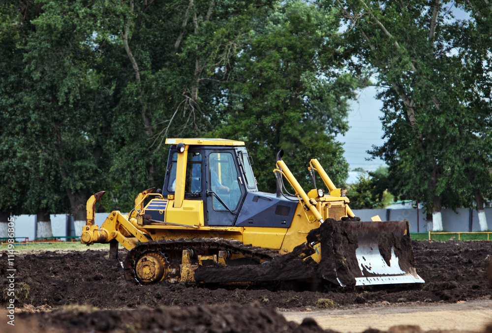 Bulldozer working at construction site Bulldozer working at construction site