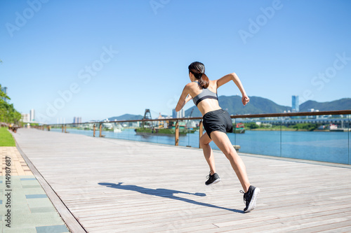 Woman running in a city of Hong Kong