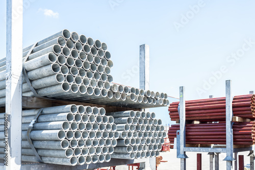 Fototapeta Stack of steel pipes for scaffolding in stock.