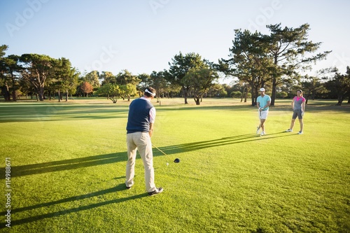 People playing golf together
