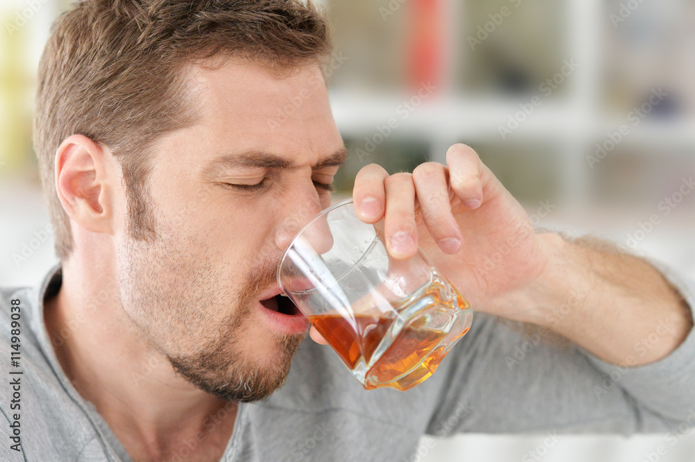 man with whiskey in glass man with whiskey in glass