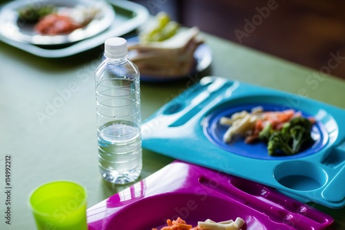 Food with water bottles on table 