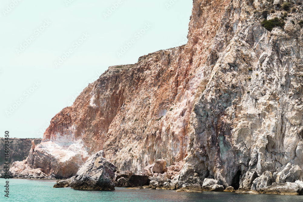 Multicolored rocks into the aegean sea in Milos island, Greece