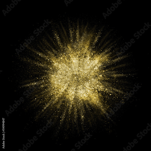 Gold glitter powder explosion. Golden color dust splash. photo