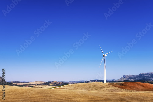 Spain, Andalusia, wind turbine and fields photo