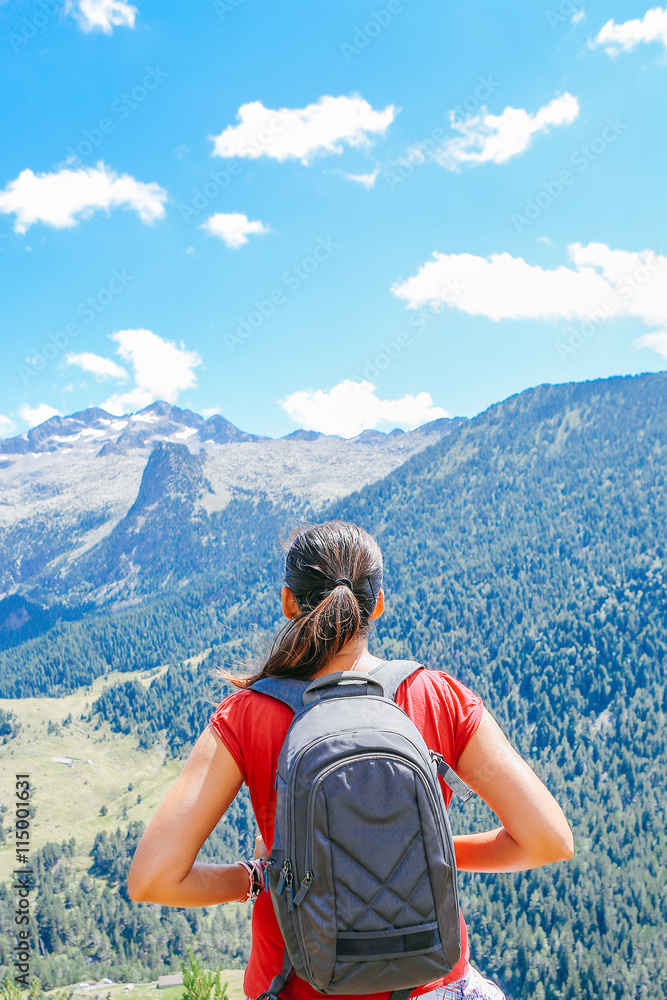Woman with backpack watching landscape