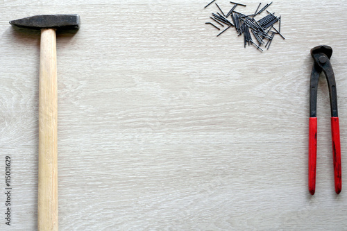 Carpenter tools with wooden background. Top view with copy space photo