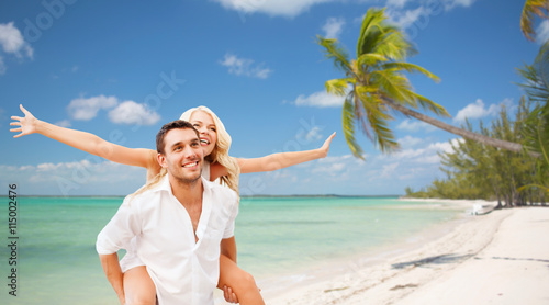 happy couple having fun over summer beach