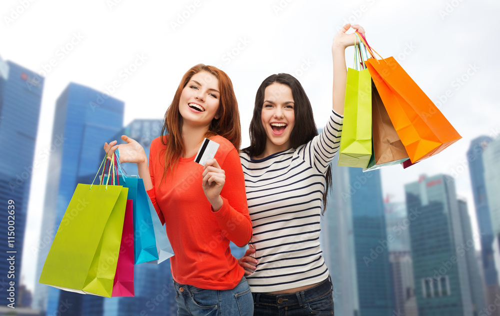 teenage girls with shopping bags and credit card teenage girls with shopping bags and credit card