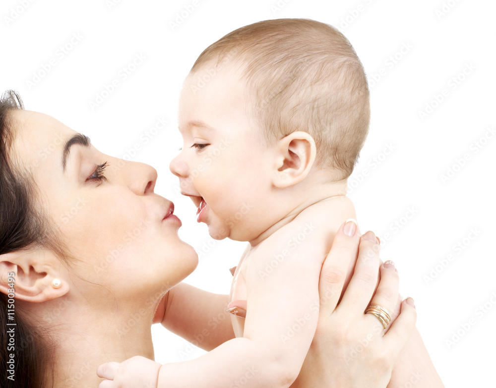 mother kissing adorable baby