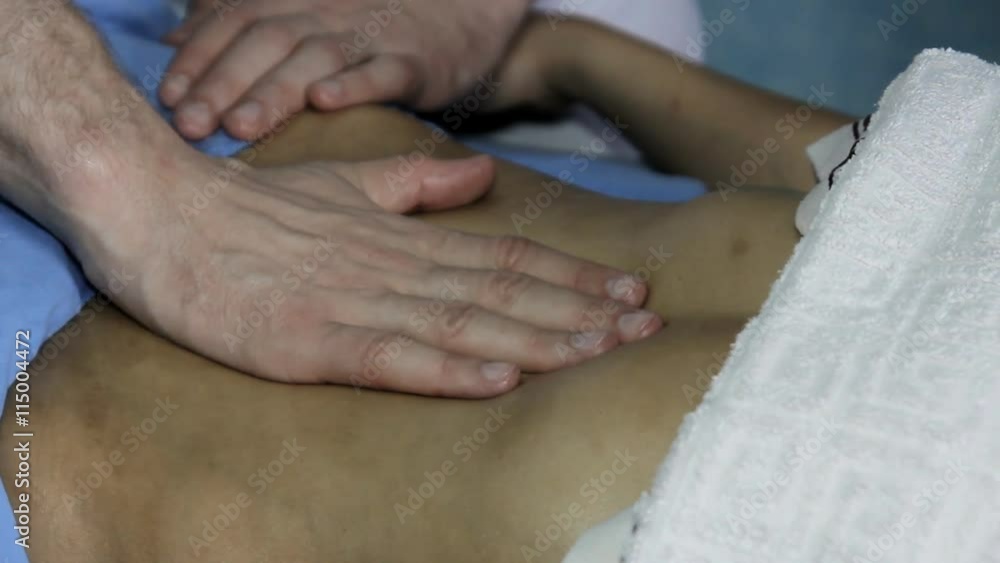 Anticellulite Massage Prevention Beautiful young woman gets a massage. Masseur makes cellulite massage of the female body Anticellulite Massage Prevention Beautiful young woman gets a massage. Masseur makes cellulite massage of the female body