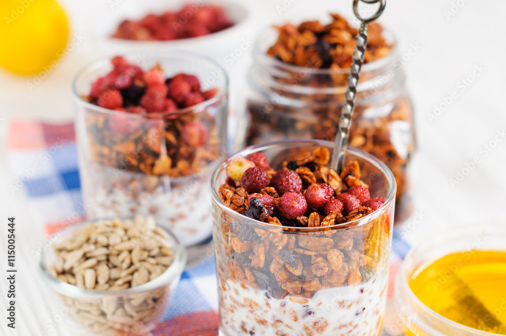 Homemade granola in open glass jar Homemade granola in open glass jar