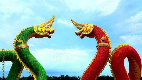 Red and green serpent king or king of naga statues in thai temple