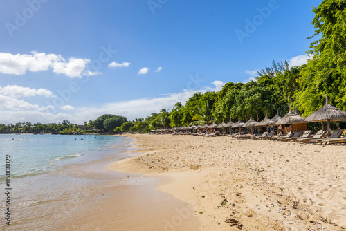 Mauritius beach umbrellas, thatch. Tropical Mauritius island water & beach resort, Turtle Bay - Balaclava