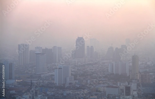 Low visibility caused by pollution problem in urban area during sunset, Bangkok, THAILAND.