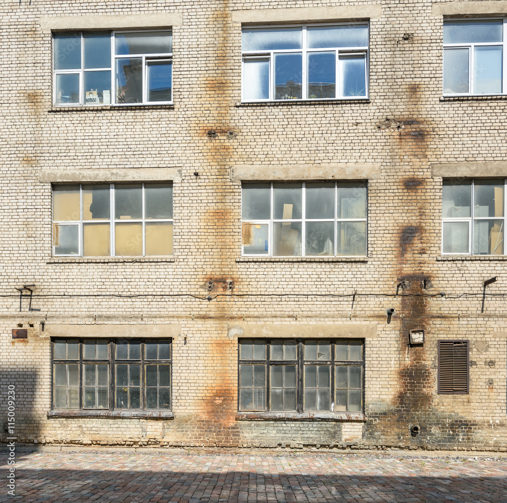 Fototapeta premium Industrial background, empty grunge urban street with brick wall